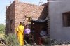Sudeep and his Family in front of his House