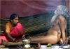 A female Devotee massaging her Guru